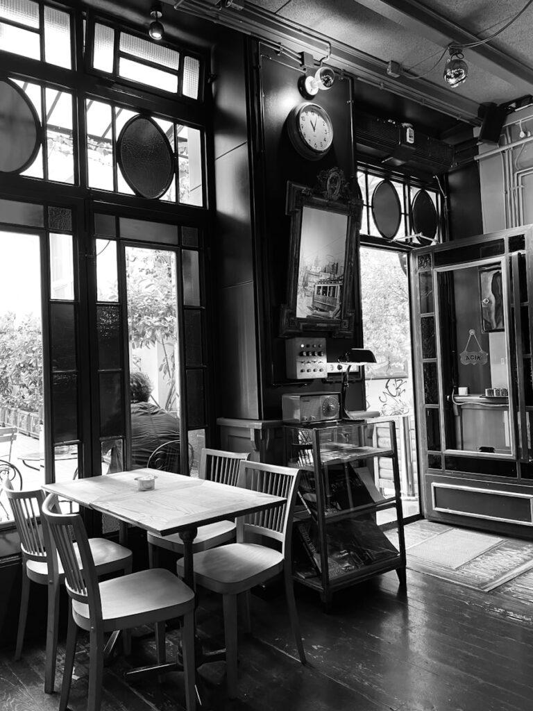 a dining room with a tv and chairs